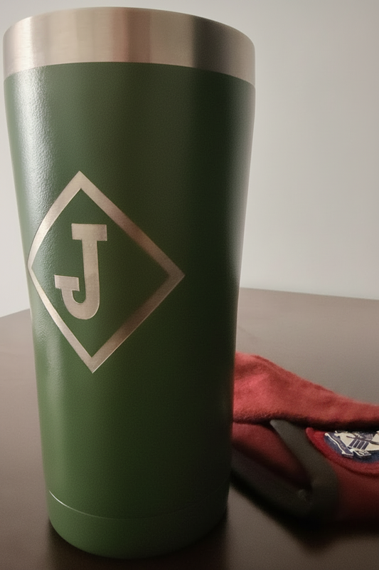 Green tumbler with a monogram of the letter 'J' in a diamond.